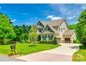 A beautiful house with a spacious lawn, a three car garage, and a lovely driveway at 288 Ridge Reserve Dr, Lake Wylie, SC 29710