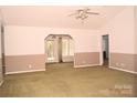 Spacious living room with large windows and a ceiling fan at 625 Court Side Dr, Salisbury, NC 28147