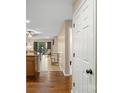 Interior hallway showcasing wood floors and an open floor plan leading to the living area at 9029 J M Keynes Dr # 63, Charlotte, NC 28262