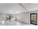 Open floorplan with a breakfast bar looking into a modern kitchen with stainless steel appliances at 11 Cobblestone Nw Ln, Concord, NC 28027