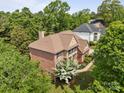 Aerial shot of home featuring a well-manicured lawn and lush landscaping at 18305 Dembridge Dr, Davidson, NC 28036