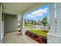 View from the covered porch shows the green landscaped neighborhood at 2020 Embassy Ct # 48, Charlotte, NC 28213