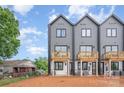 Townhome backyard featuring private balconies, showcasing outdoor living spaces in a contemporary urban setting at 204 Mattoon St, Charlotte, NC 28216