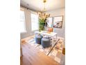 Bright home office with ample natural light, modern decor, and comfortable seating for a productive work environment at 313 Old Town Village Rd, Waxhaw, NC 28173