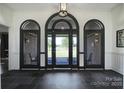 Elegant foyer featuring black tile flooring and a front door with sidelight windows at 3270 Kings Row Dr, Rock Hill, SC 29732