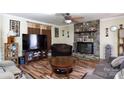Inviting living room with a stone fireplace, wood floors, and neutral decor at 3842 Harmony Rd, Catawba, SC 29704