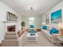 Bright living room features hardwood floors, neutral furniture, and decorative fireplace at 412 Keels Ave, Rock Hill, SC 29730