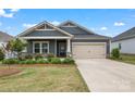 Charming home features a landscaped yard, neutral exterior, and a two-car garage at 4171 Canopy Creek Dr, Denver, NC 28037