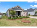 Beautiful home showcasing manicured landscaping and neutral exterior paint at 4171 Canopy Creek Dr, Denver, NC 28037