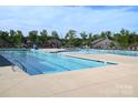Spacious community pool with lap lanes, lounge chairs, and plenty of space for relaxation and recreation at 4171 Canopy Creek Dr, Denver, NC 28037