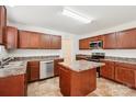 Well-equipped kitchen with central island, stainless steel appliances, and ample cabinetry at 5030 Ashley Place Dr, Bessemer City, NC 28016
