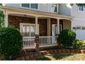 View of front porch with stone accents, white railings, and decorative columns at 5106 Stone Park Dr, Charlotte, NC 28269
