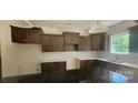 Modern kitchen with dark cabinets and granite countertops at 532 Robinhood Rd # 27, Maiden, NC 28650