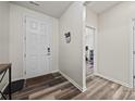 Bright foyer with wood-look floors, white door, and views to other rooms at 536 Rustlewood Way, Rock Hill, SC 29732