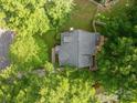 Aerial view of the property showcasing the roof, deck, and surrounding greenery at 741 Bermuda Ave, Gastonia, NC 28054