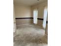 Empty room featuring striped wallpaper, offering potential for customization at 7505 Conifer Cir, Indian Trail, NC 28079