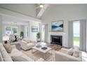 Bright living room with vaulted ceilings, fireplace, hardwood floors, and natural light at 7810 Trotter Rd, Charlotte, NC 28216