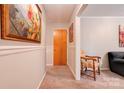Inviting hallway featuring neutral paint, elegant chair rail and plush carpeting at 910 Surry Dr, Shelby, NC 28152