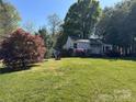 Charming home on a spacious lot with mature trees and flowering shrubs, offering serene outdoor living at 1059 16Th Nw Ave, Hickory, NC 28601
