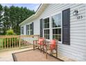 Relax on the inviting deck with comfortable chairs, perfect for enjoying the outdoors at 125 Rocky Pt, Cleveland, NC 27013