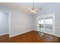 Bright dining room featuring modern lighting and sliding glass doors to patio at 1455 Fieldcrest Cir, Rock Hill, SC 29732
