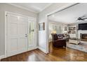 Welcoming living room showcases hardwood floors and comfortable seating, enhanced by natural light and a cozy fireplace at 1467 Alexander Rd, Rock Hill, SC 29732