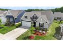 An aerial view of a new construction home showing off the landscaping and a two-car garage at 167 White Apple Way, Statesville, NC 28625