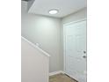 Bright entryway with white door, recessed lighting, and modern flooring at 1931 Mereview Ct # 46, Charlotte, NC 28210