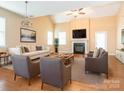 Bright living room featuring a fireplace, comfortable seating, and hardwood floors at 208 Fielding St, Mount Holly, NC 28120
