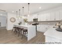 Bright and airy kitchen featuring a large center island, pendant lighting, and stainless steel appliances at 2309 Bulwarks Ct # 4P, Albemarle, NC 28001