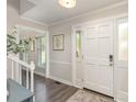 Inviting foyer with hardwood floors and staircase, featuring natural light from the front door at 2514 King Arthur Dr, Monroe, NC 28110