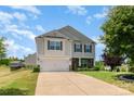 Lovely two-story home with a two-car garage, green lawn, and inviting curb appeal at 2739 Golden Rose Ln, Charlotte, NC 28216