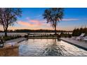 Beautiful waterfront pool with relaxing lounge chairs and stunning sunset views at 356 Yacht Rd, Mooresville, NC 28117