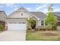 Charming single-story home with brick and stone accents, attached garage, and beautifully landscaped front yard at 3618 Marchers Trace Dr, Mint Hill, NC 28227