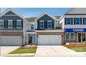 New construction home with stone accents, a two-car garage, and manicured landscaping at 4208 Steel Way, Sherrills Ford, NC 28673