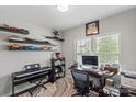 Bright office with decorative floating shelves, modern desk, and gray-beige marble rug for an inspiring workspace at 980 Bunker Trce, Rock Hill, SC 29730