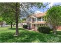 View of a two story home featuring a well kept lawn and healthy landscaping at 101 Canopy Ct, Mooresville, NC 28115