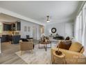 Open living area featuring hardwood floors, ceiling fan and views of the kitchen at 1090 Bowser St, Rock Hill, SC 29730