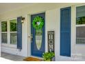 Inviting front entrance with a decorative wreath and welcome sign at 1090 Bowser St, Rock Hill, SC 29730