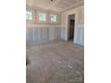 Spacious living room with bare drywall and windows providing natural light at 110 Canary Ln # 3, Mooresville, NC 28115