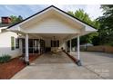 The home's roomy carport area also includes a screened-in back porch at 1115 Old Thompson Ave, Lancaster, SC 29720