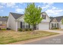 Charming home featuring a 2-car garage, landscaped yard, and inviting front entrance at 1125 Silvertrace Dr, Salisbury, NC 28144