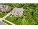 Aerial view of home with well-manicured lawn and landscaping highlighting its great curb appeal at 11424 Brangus Ln, Mint Hill, NC 28227