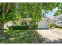 Charming two-story home with a welcoming front porch and well-maintained landscaping offers great curb appeal at 12016 Gemstone Ct, Charlotte, NC 28269