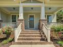 Inviting front porch with brick steps and white railing at 1222 Kings Bottom Dr, Fort Mill, SC 29715