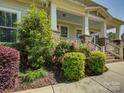 Landscaped entrance featuring brick accents and colorful flower beds at 1222 Kings Bottom Dr, Fort Mill, SC 29715