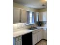 Kitchen with white cabinets, stainless sink, updated fixtures, and black appliances at 2473 Greenwood Rd, Rock Hill, SC 29730