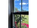 Up-close shot of the window with red flowers outside at 2473 Greenwood Rd, Rock Hill, SC 29730