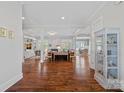 Open-concept living space with hardwood floors and multiple built-ins at 309 Catawba Ave, Davidson, NC 28036