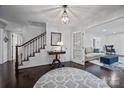 Elegant foyer with hardwood floors, staircase, and an open view to the living room at 4611 Cringle Ct, Charlotte, NC 28226